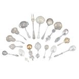 A collection of various European fancy spoons and sifter spoons