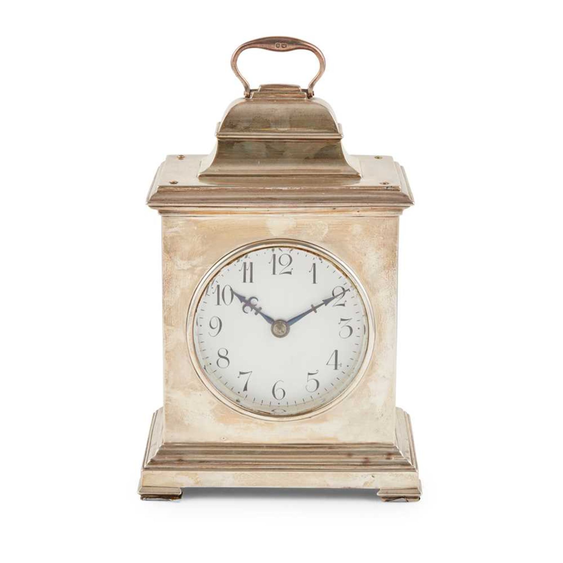 A large silver cased mantle clock