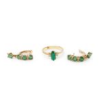 An emerald and diamond ring and earrings