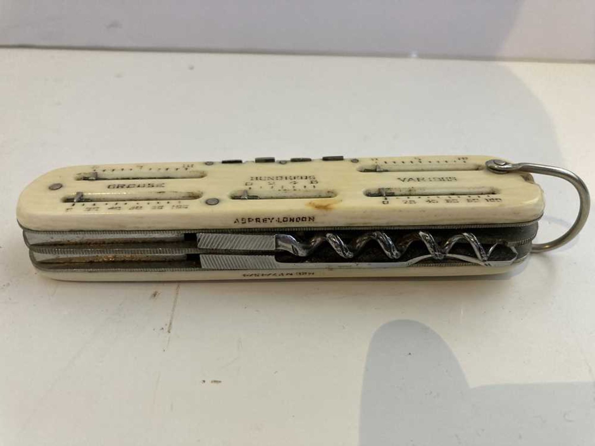 A 1920s ivory pen knife/ game counter, Asprey - Image 8 of 16