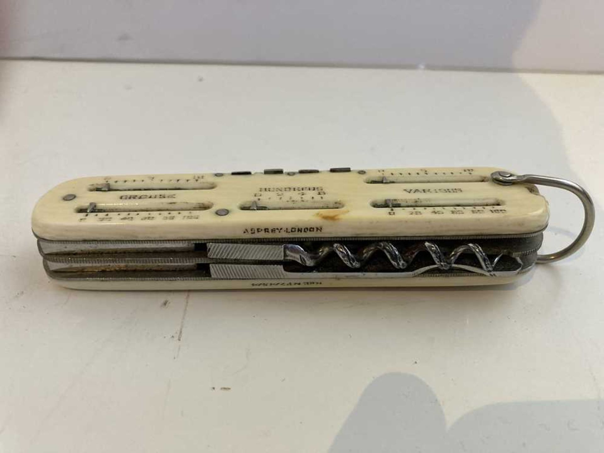 A 1920s ivory pen knife/ game counter, Asprey - Image 15 of 16