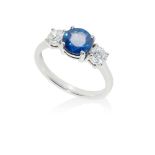 A sapphire and diamond three-stone ring