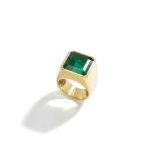 An emerald single-stone ring