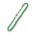 An early 20th century jadeite jade, ruby and diamond necklace, circa 1930