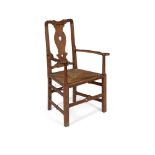 MANNER OF SIR ROBERT LORIMER CARVER ARMCHAIR, CIRCA 1900