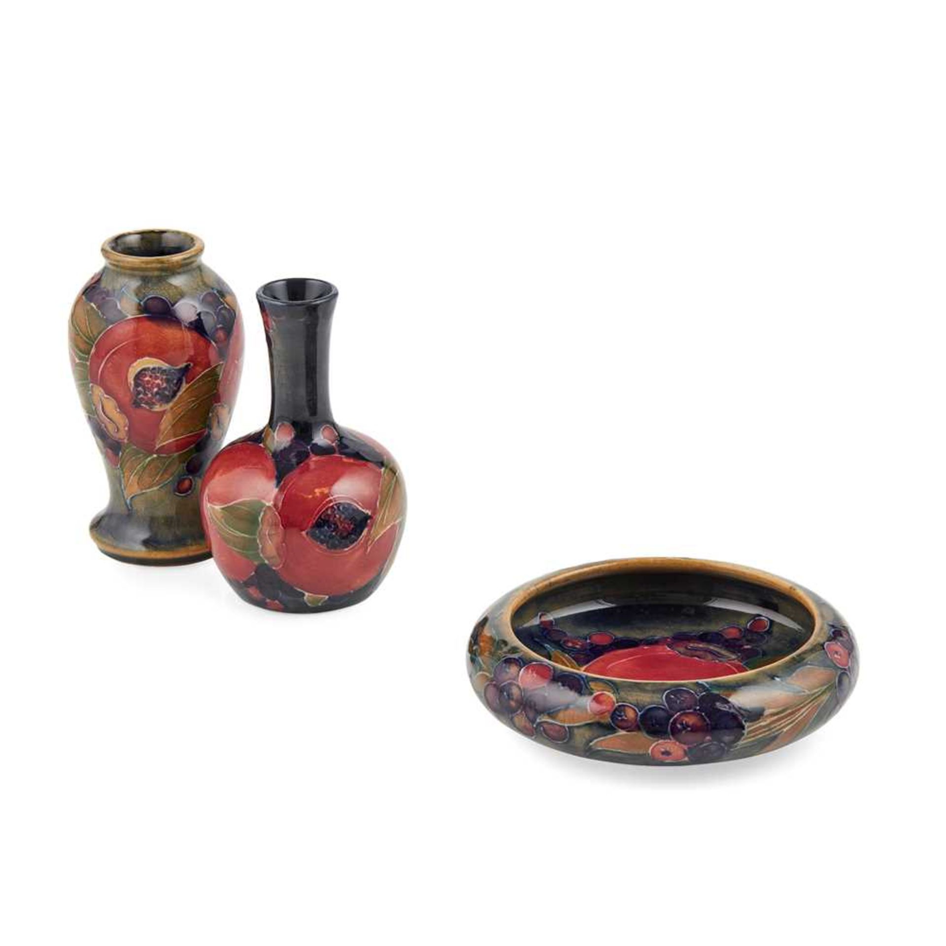 WILLIAM MOORCROFT (1872-1945) FOR MOORCROFT POTTERY TWO MINIATURE ‘POMEGRANATE’ PATTERN VASES, CIRCA