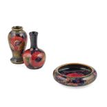 WILLIAM MOORCROFT (1872-1945) FOR MOORCROFT POTTERY TWO MINIATURE ‘POMEGRANATE’ PATTERN VASES, CIRCA