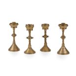 ENGLISH TWO PAIRS OF GOTHIC REVIVAL CANDLESTICKS, CIRCA 1880