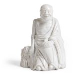WHITE-GLAZED FIGURE OF AN ARHAT QING DYNASTY, 18TH-19TH CENTURY