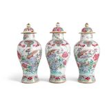 GROUP OF THREE FAMILLE ROSE LIDDED BALUSTER VASES QING DYNASTY, 18TH CENTURY