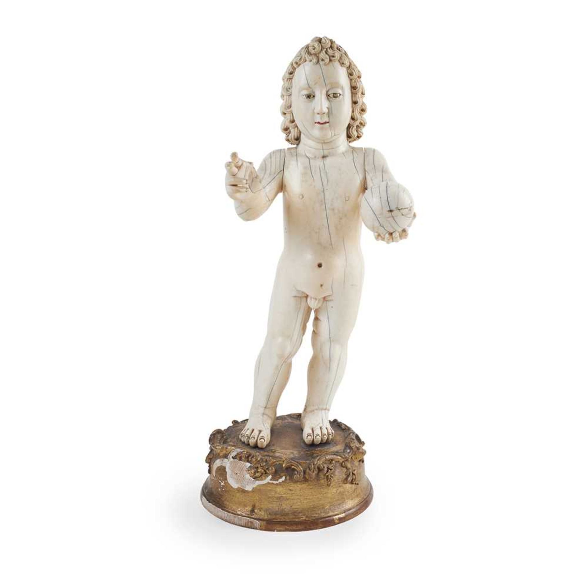 LARGE INDO-PORTUGUESE CARVED IVORY FIGURE OF THE INFANT CHRIST AS SALVATOR MUNDI, THE SAVIOUR OF THE