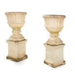 PAIR OF COMPOSITION STONE URNS AND PEDESTALS EARLY 20TH CENTURY