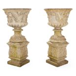 PAIR OF COMPOSITION STONE URNS AND PEDESTALS 20TH CENTURY