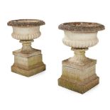 PAIR OF COMPOSITION STONE URNS AND PEDESTALS 20TH CENTURY