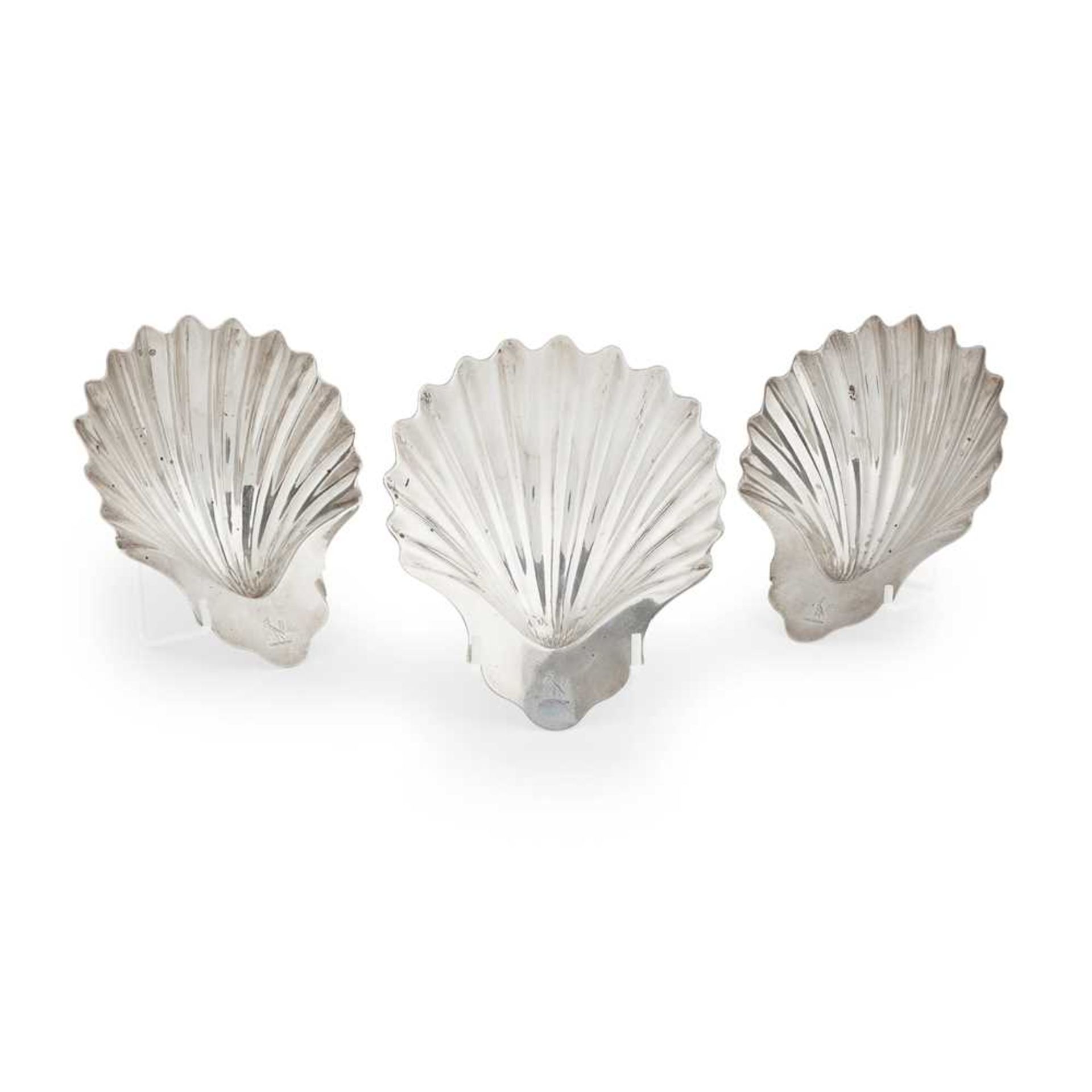 A set of three George III scallop butter dishes