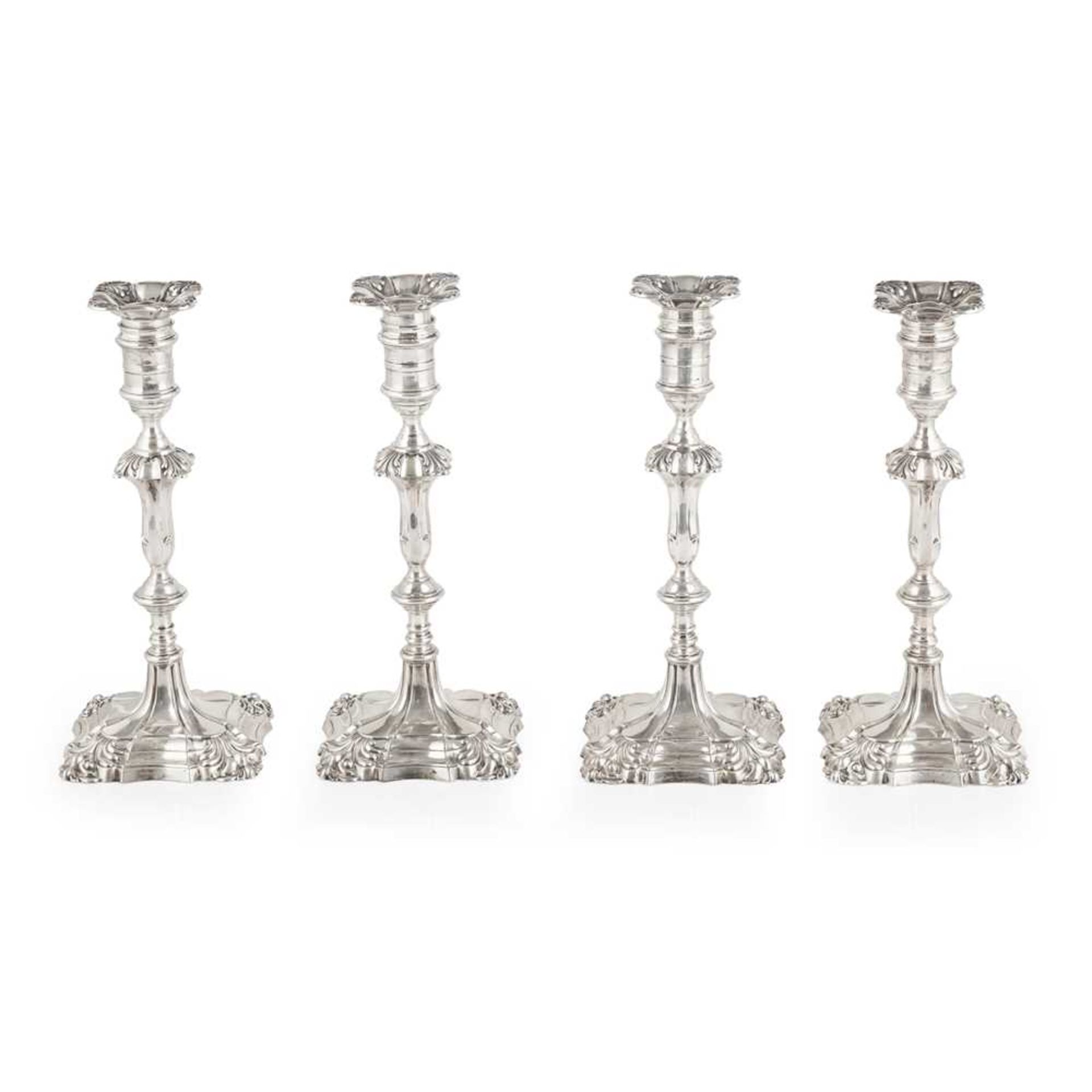 A set of four Edwardian table candlesticks