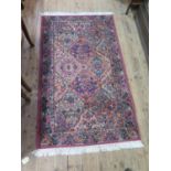 A pair of Karastan 'Kirman' design rugs, with all over shaped panel design filled with floral