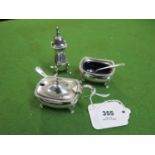 A silver plated three piece condiment set by Mappin & Webb, a pair of salt cellars with wavy edge