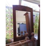 A 1930s Art Deco design oak framed wall mirror, the moulded frame enclosing a rectangular plate,