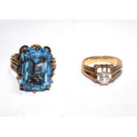 A 9 carat gold ladies ring set with a large blue stone together with a 9 carat gold ring set with