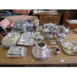 A large collection of silver plate to include tea sets, entre dishes, meat covers, dishes, etc, (