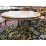 A mid Victorian mahogany looe table, the oval snap top (lacking attachments) on four turned supports