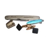 A miniature enamel pen knife, another penknife and a small thimble and a pair of links