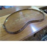 An Edwardian inlaid mahogany kidney-shape tray, with foliate scroll design and brass handles, 68 x