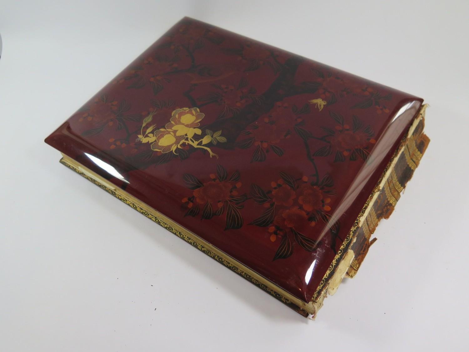 A Japanese red lacquered and mother of pearl inset photo album, containing fifty coloured - Image 5 of 5
