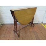 An Edwardian mahogany Sutherland table, the oval top on turned supports and bracket feet with