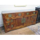 A Chinese cypress wood sideboard, the four frieze drawers over a pair of cupboard doors flanked by a