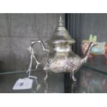 A silver colour metal tea pot