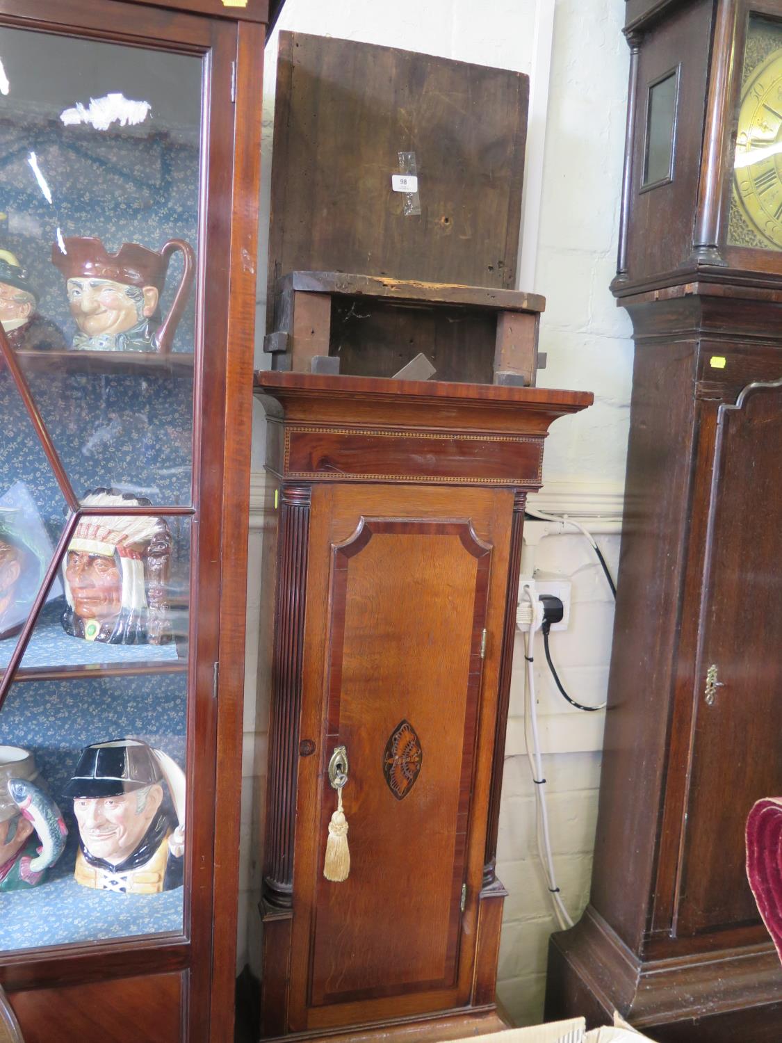 An early 19th century oak and mahogany crossbanded longcase clock, the painted square dial inscribed