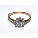 A 9 carat gold ring set with faux diamonds