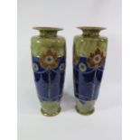 A pair of Royal Doulton stoneware vases, in blue and green with floral and beaded garland