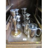 A pair of silver plate candelabra, a three piece Elkington plate tea service, a hot water pot and