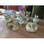 Eight Yare Design figures of dragons, including a pair on a see-saw, 18cm wide (8)