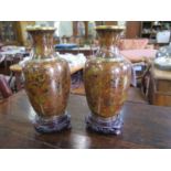 A pair of Japanese cloisonne enamel vases, with all over chrysanthemum design, 20 cm high (2)