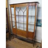 An Edwardian chequerbanded mahogany display cabinet, with central ogee glazed and panellled door