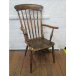 An ash and elm kitchen armchair, with turned rail back, moulded seat and turned legs joined by