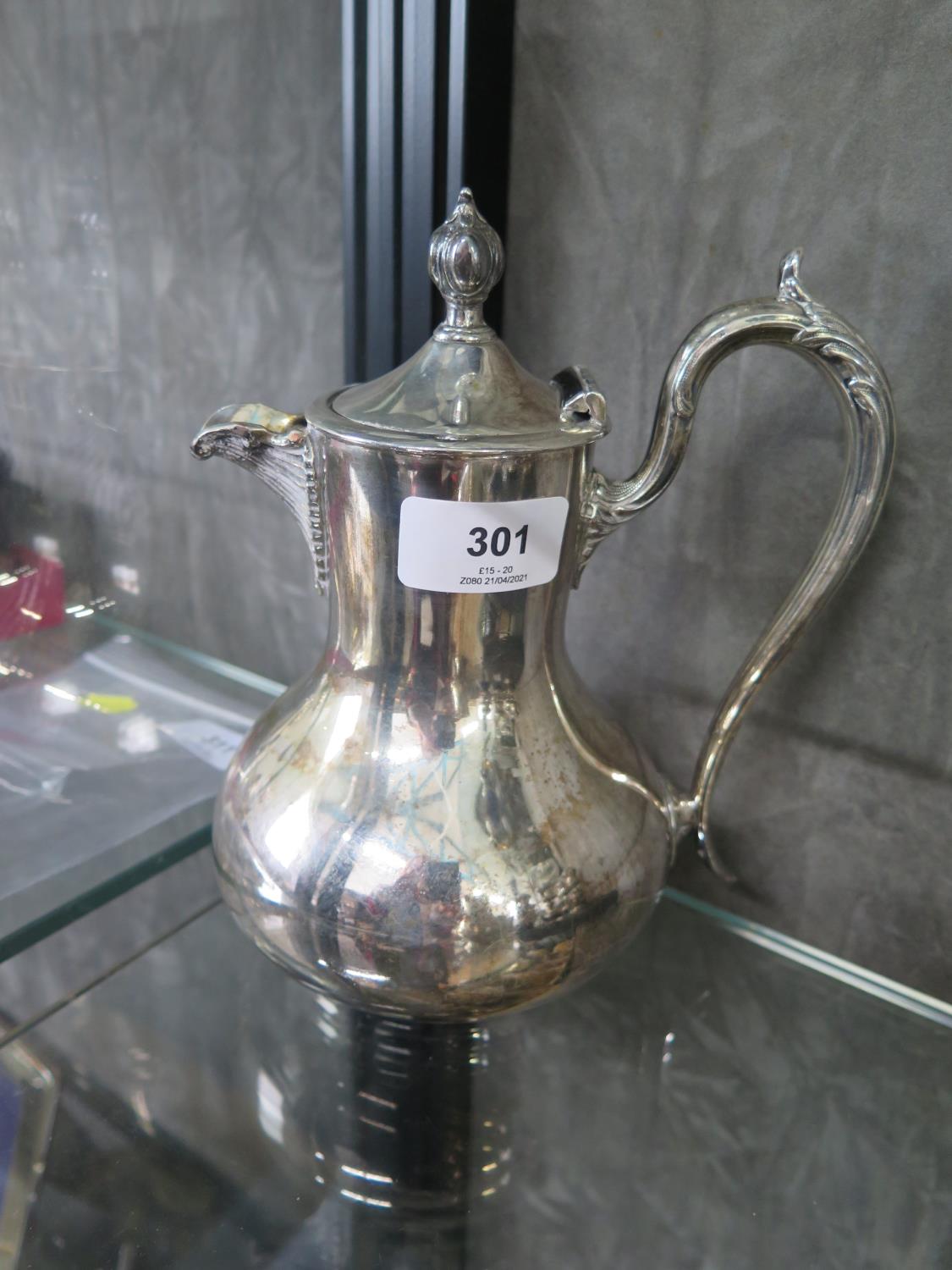 A silver plated water jug