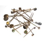 A large bag of 22 tie pins, some diamond set, and an Edwardian gold colour pencil