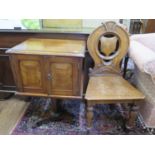 A Victorian oak hall chair, with shield back and turned legs, and a bedside cabinet, formed of