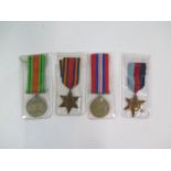A set of four World War II medals, including the Burma Star, 1939-45 Star, Defence Medal, and War