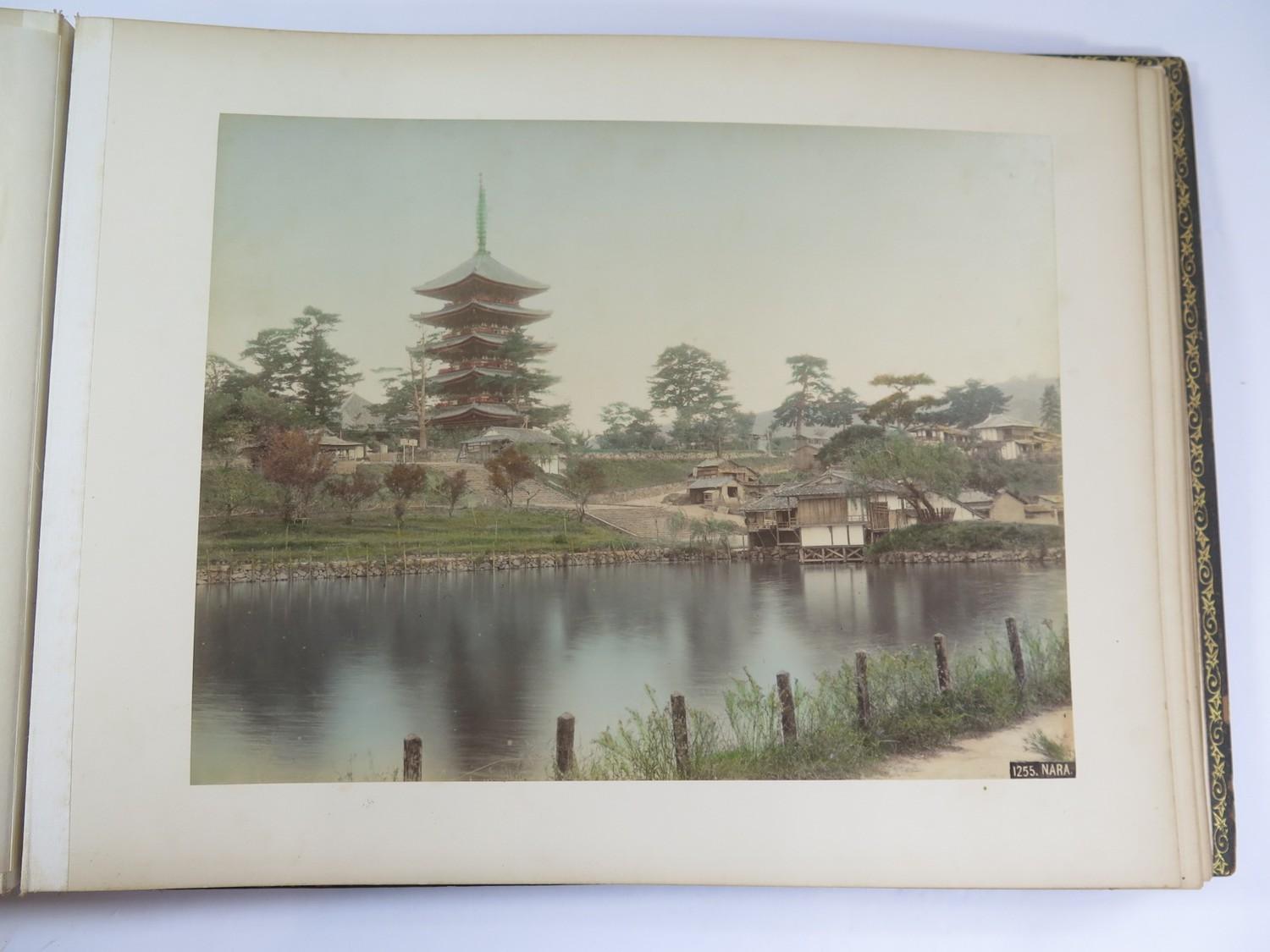 A Japanese red lacquered and mother of pearl inset photo album, containing fifty coloured - Image 2 of 5