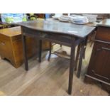 A George III oak side table, the shaped top over a frieze drawer, on square section legs, joints