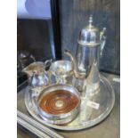 A three piece EPNS coffee set, a circular salver and a wine coaster