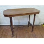 An Edwardian mahogany side table, the canted rectangular top on ring turned tapering legs joined