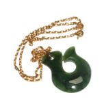 A green stone pendant on 9 carat gold neck chain