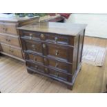 An early 18th oak chest of drawers, with four long graduated panelled drawers, with grooved linings,